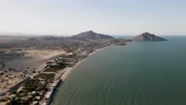 SAN FELIPE BC MEXICO-2023: Beach And A Body Of Water With A Mountain In The