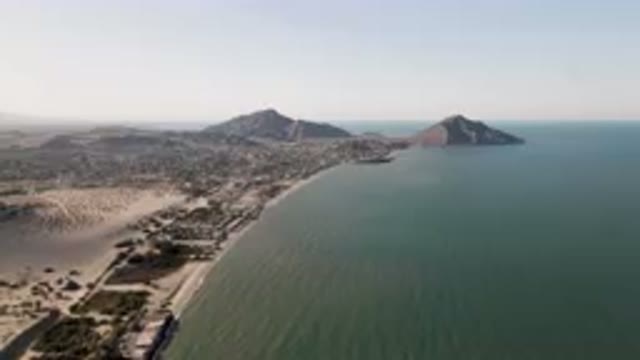SAN FELIPE BC MEXICO-2023: Beach And A Body Of Water With Mountains In The Background