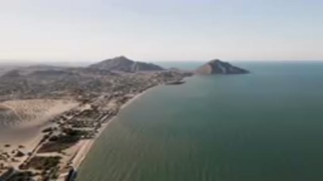 SAN FELIPE BC MEXICO-2023: Beach And A Body Of Water With A Mountain In The