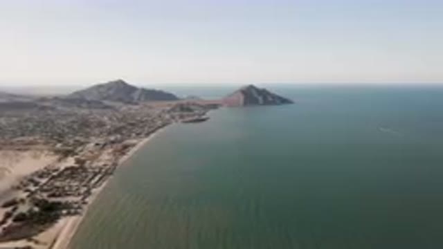 SAN FELIPE BC MEXICO-2023: Beach And A Body Of Water With A Mountain In The