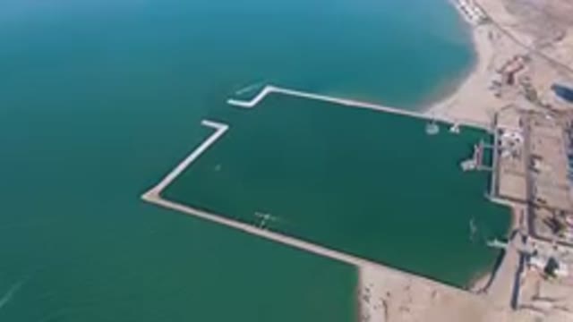 SAN FELIPE BC MEXICO-2023: Aerial View of Large Body of Water with Dock and Boat