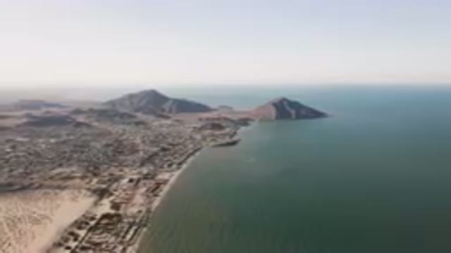 SAN FELIPE BC MEXICO-2023: Beach And A Body Of Water With A Mountain In The