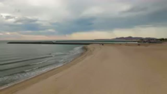 SAN FELIPE BC MEXICO-2023: Beach With A Long Pier And A Boat In The Water