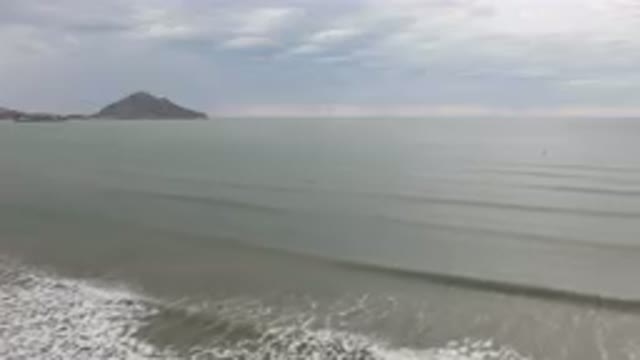 SAN FELIPE BC MEXICO-2023: Man Riding A Surfboard On The Beach
