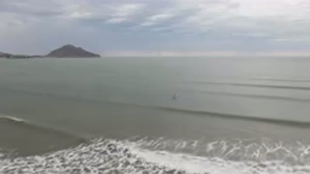 SAN FELIPE BC MEXICO-2023: Surfers Riding Waves In The Ocean Near A
