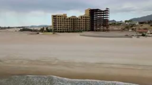 SAN FELIPE BC MEXICO-2023: Man Walking On The Beach With A Surfboard
