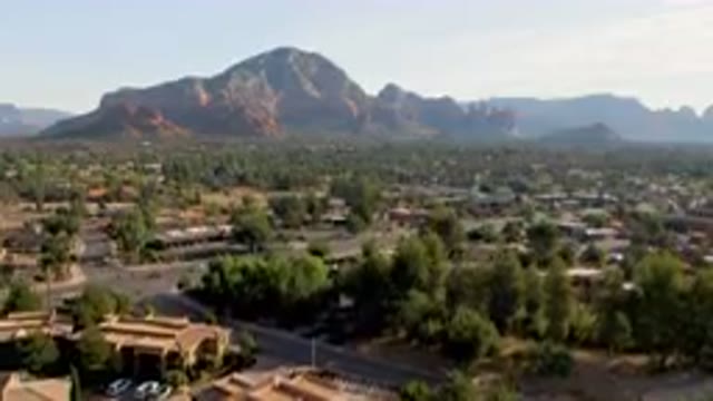SEDONA ARIZONA USA-2023: Mountains In The Distance With A Town In The Foreground