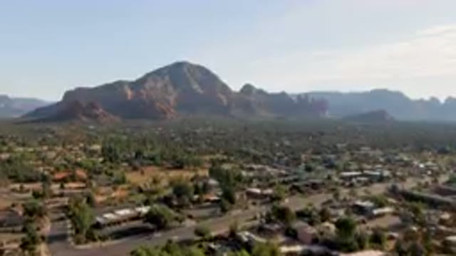 SEDONA ARIZONA USA-2023: Mountains In The Distance With A Town In The Foreground