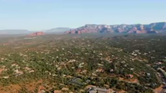 SEDONA ARIZONA USA-2023: Aerial Town In The Mountains With A Mountain Range In