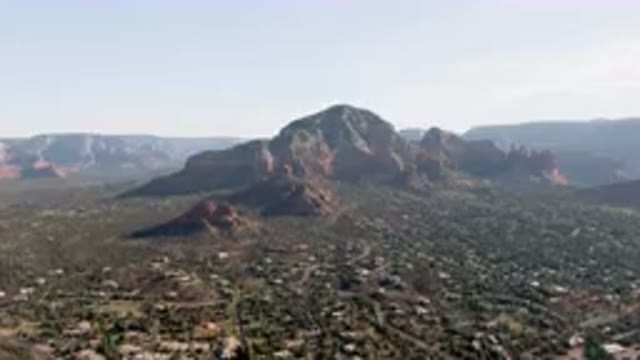 SEDONA ARIZONA USA-2023: Mountains And Valleys With A Town In The Foreground