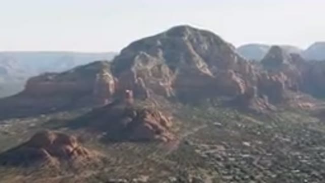 SEDONA ARIZONA USA-2023: Mountains With A Town Below Them And A Valley Below