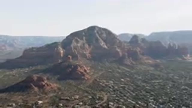 SEDONA ARIZONA USA-2023: Mountains With A Valley In The Foreground And A Town