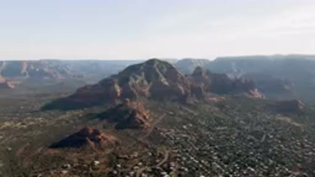 SEDONA ARIZONA USA-2023: Mountains With A City Below Them And A Valley Below