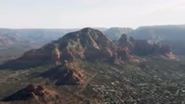 SEDONA ARIZONA USA-2023: Mountains With A City Below Them And A Valley Below