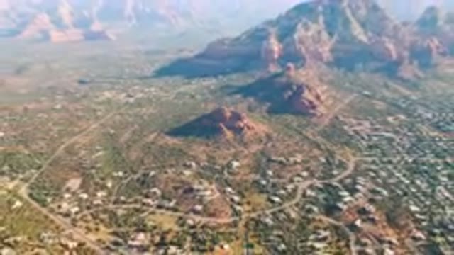 SEDONA ARIZONA USA-2023: Aerial City In The Mountains With A Mountain Range In