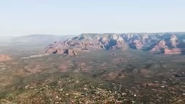 SEDONA ARIZONA USA-2023: Aerial Valley With A Mountain Range In The Background