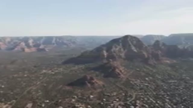 SEDONA ARIZONA USA-2023: Mountains With A City Below Them And A Valley Below