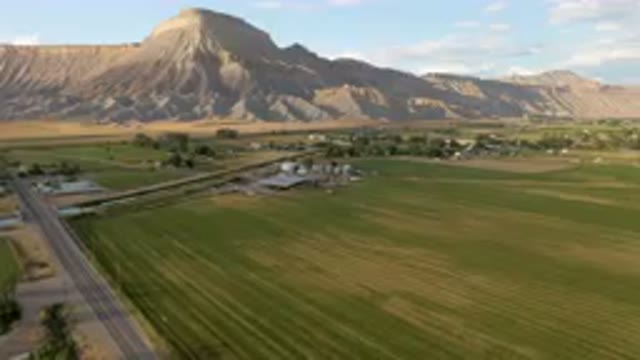 PALISADES COLORADO USA-2023: Farm With A Mountain In The Background