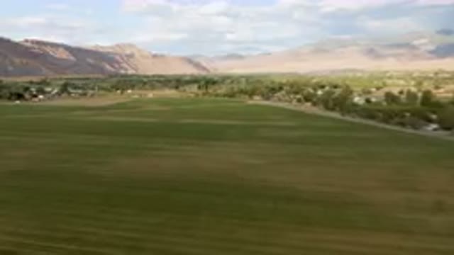 PALISADES COLORADO USA-2023: Green Field With A Small Town In The Distance