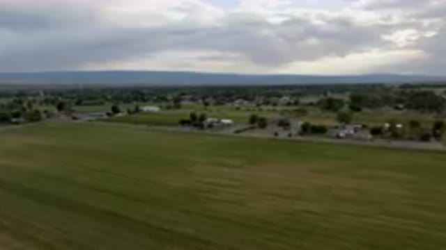 PALISADES COLORADO USA-2023: Wide Aerial View of Grass Field and Scattered Houses