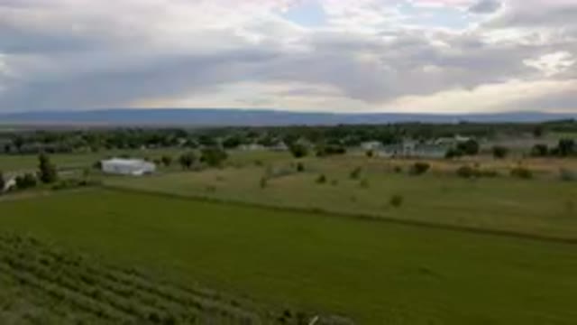 PALISADES COLORADO USA-2023: Field With A Fence And A House In The Distance