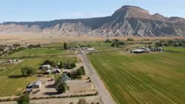 PALISADES COLORADO USA-2023: Aerial Farm With A Road And A Mountain In The