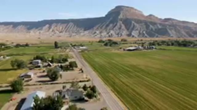 PALISADES COLORADO USA-2023: Aerial Farm With A Road And A Mountain In The