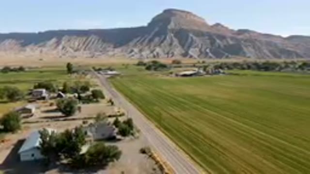 PALISADES COLORADO USA-2023: Aerial Farm With A Road And A Mountain In The