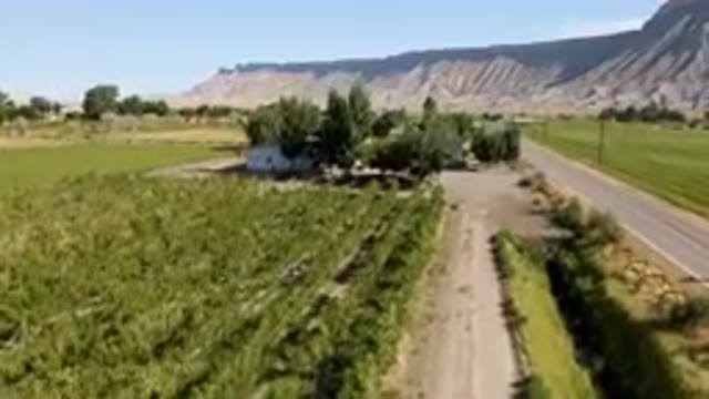 PALISADES COLORADO USA-2023: Dirt Road That Leads To A Farm With A Mountain In