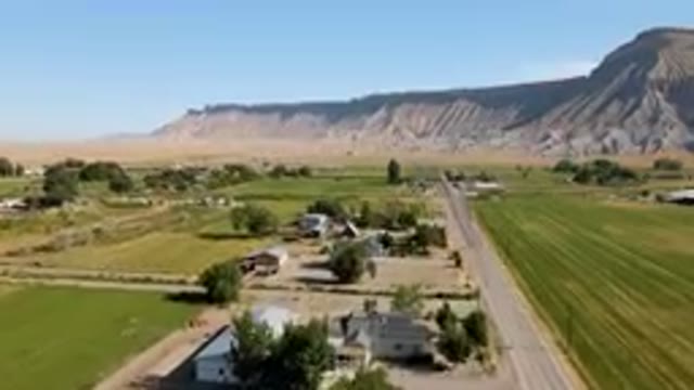 PALISADES COLORADO USA-2023: Aerial Farm With A Road And A Mountain In The