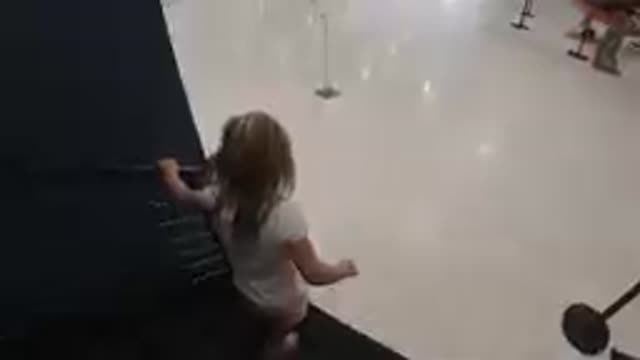Young Girl Running Down Stairs. Denver, Colorado