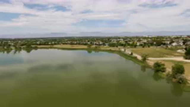 BROOMFIELD COLORADO USA-2023: Lake With A Small Town In The Distance
