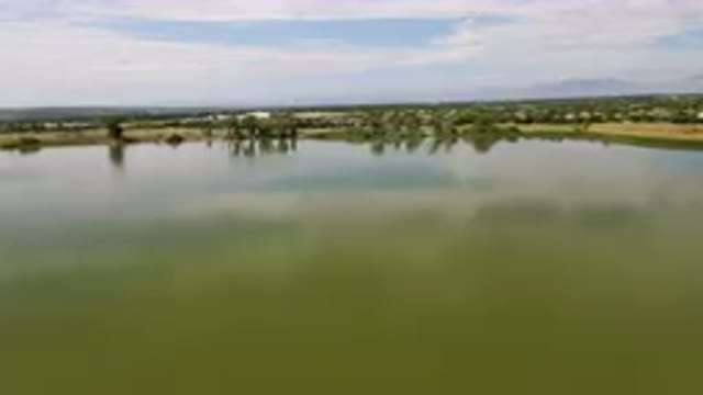 BROOMFIELD COLORADO USA-2023: Large Body Of Water With A Small Boat In It