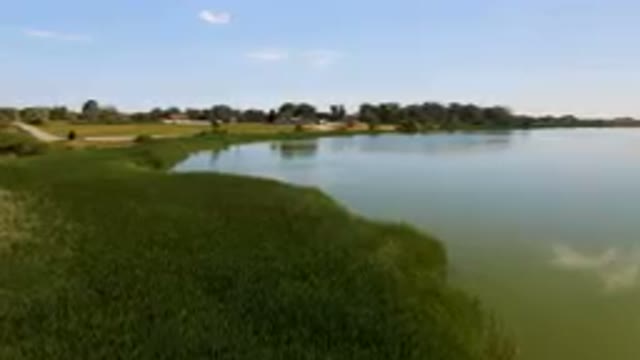 BROOMFIELD COLORADO USA-2023: Large Body Of Water With A Small Boat In It
