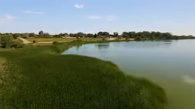 BROOMFIELD COLORADO USA-2023: Large Body Of Water With A Small Boat In It