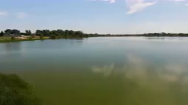 BROOMFIELD COLORADO USA-2023: Large Body Of Water With A Small Boat In It