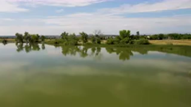 BROOMFIELD COLORADO USA-2023: Large Body Of Water With A Small Boat In It