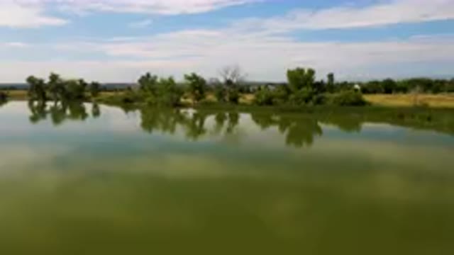 BROOMFIELD COLORADO USA-2023: Large Body Of Water With A Small Boat In It