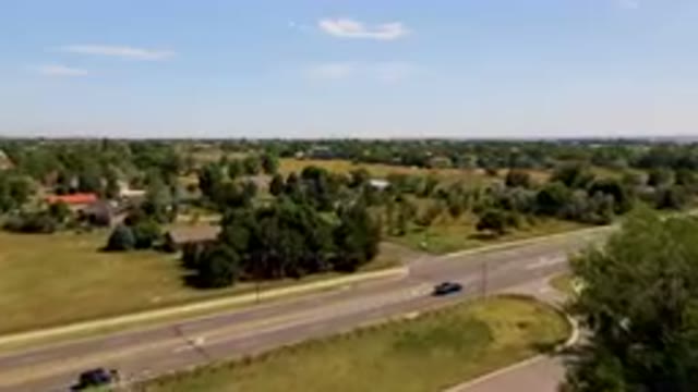 BROOMFIELD COLORADO USA-2023: Car Driving Down The Road In The Middle Of The