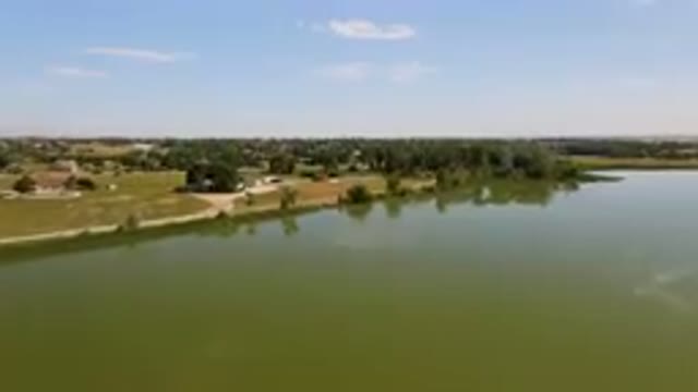 BROOMFIELD COLORADO USA-2023: Lake With A Small Town In The Distance