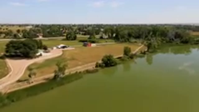 BROOMFIELD COLORADO USA-2023: Aerial Farm With A Pond And A Barn