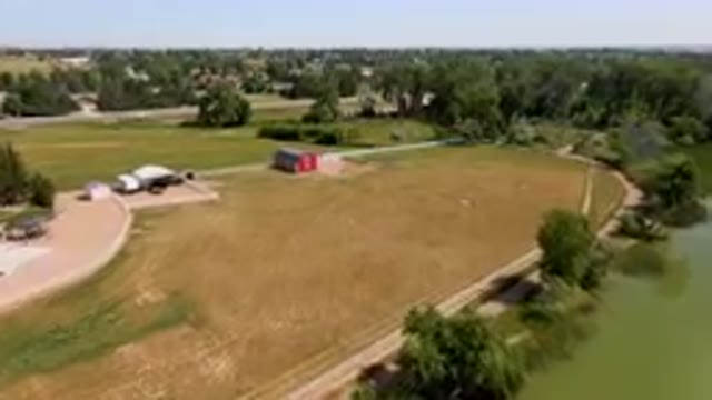 BROOMFIELD COLORADO USA-2023: Aerial Farm With A Red Barn And A Pond