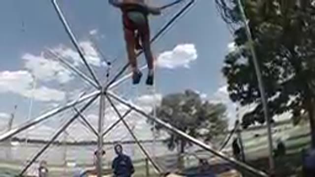 Little Girl on Bungee Carnival Attraction. Denver. Colorado