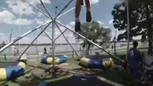 Little Girl Strapped Into Trampoline Jumper. Denver, Colorado.
