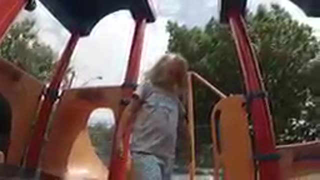 COLORADO UNITED STATES-2019: Young Girl Playing On Outdoor Playground Equipment