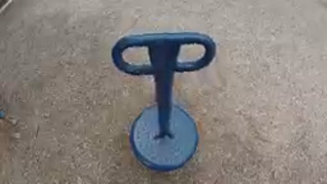 Blue Plastic Object On A Playground Ground