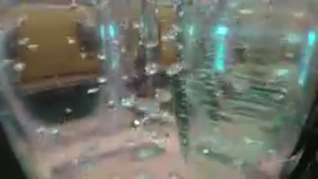 Close Up Of A Glass Air Bubbles In Water