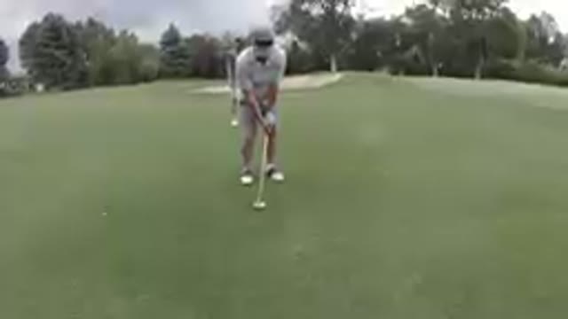 Playing Golf: Dad Follows Through