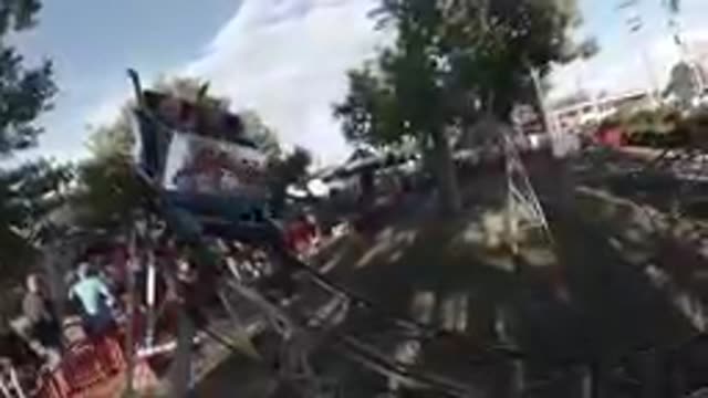 Amusement Park: Kids Enjoying Kiddie Rollercoaster