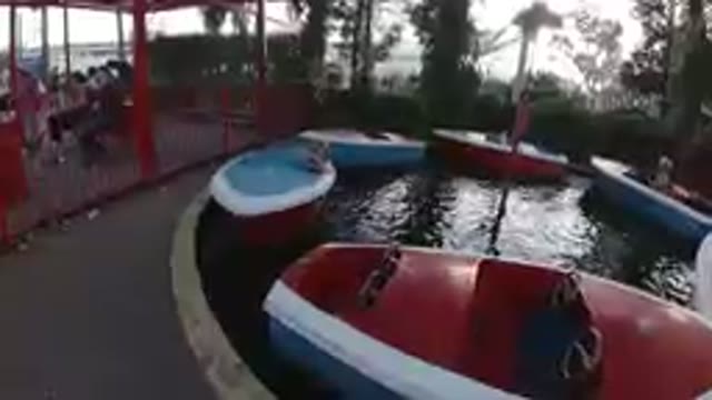 Amusement Park: Happy Children Riding Speed Boat Carousel